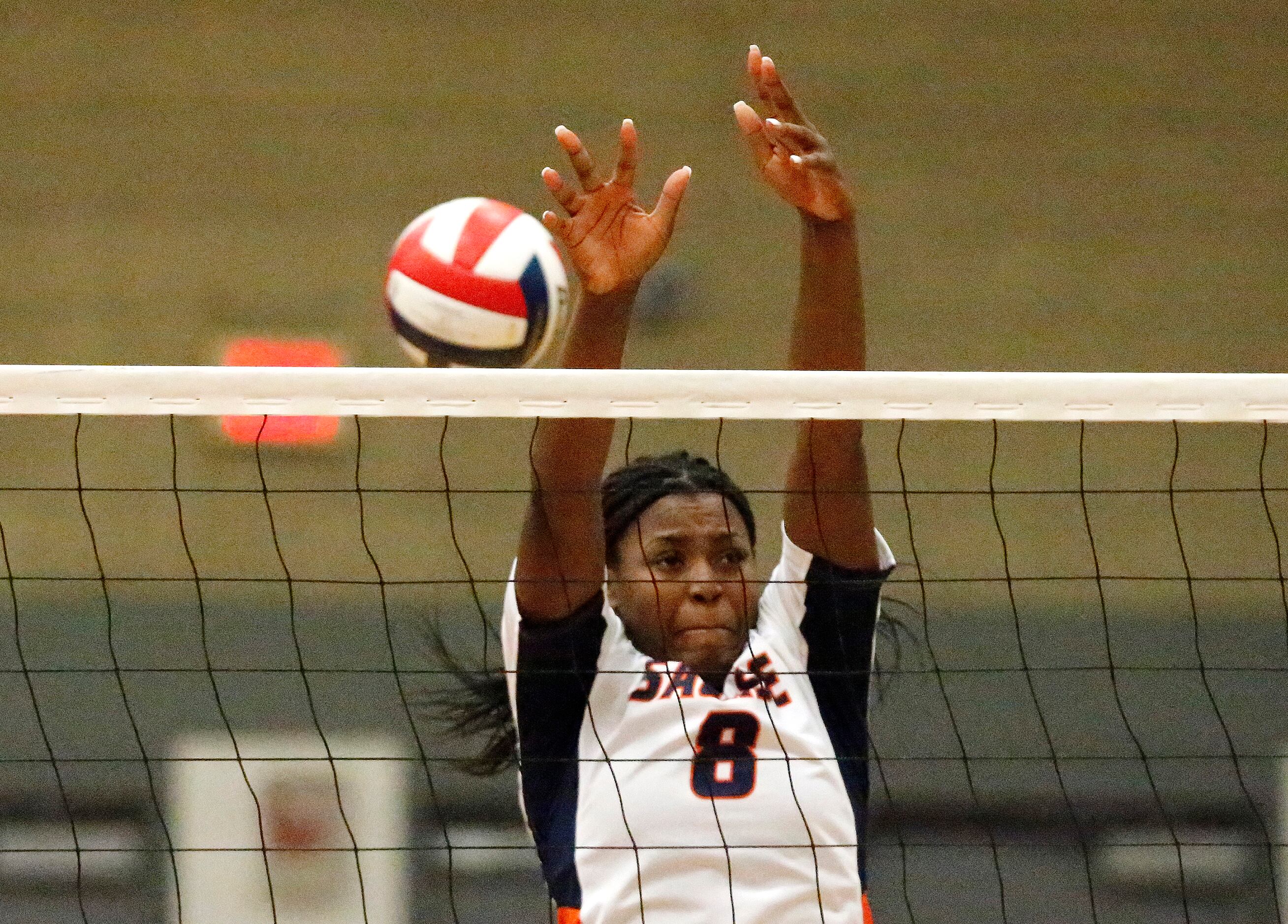 Sachse High School outside hitter Alicia Hearn (8) attempts a block during game two as...
