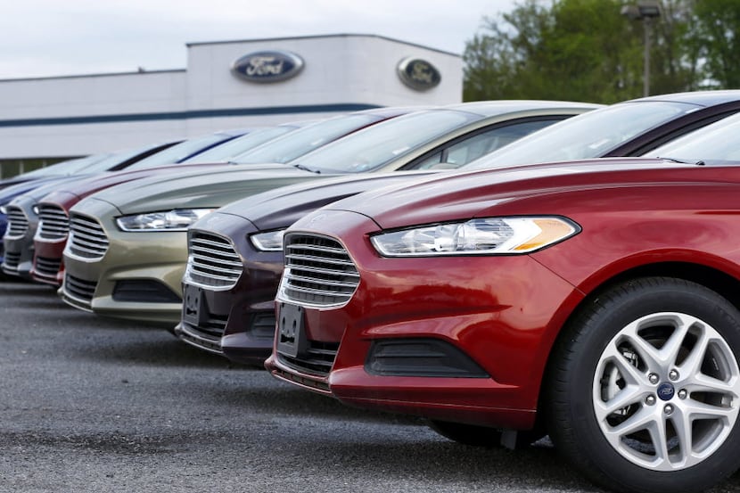 A row of Ford Fusions on display at an automobile dealership in Pennsylvania.  (AP...