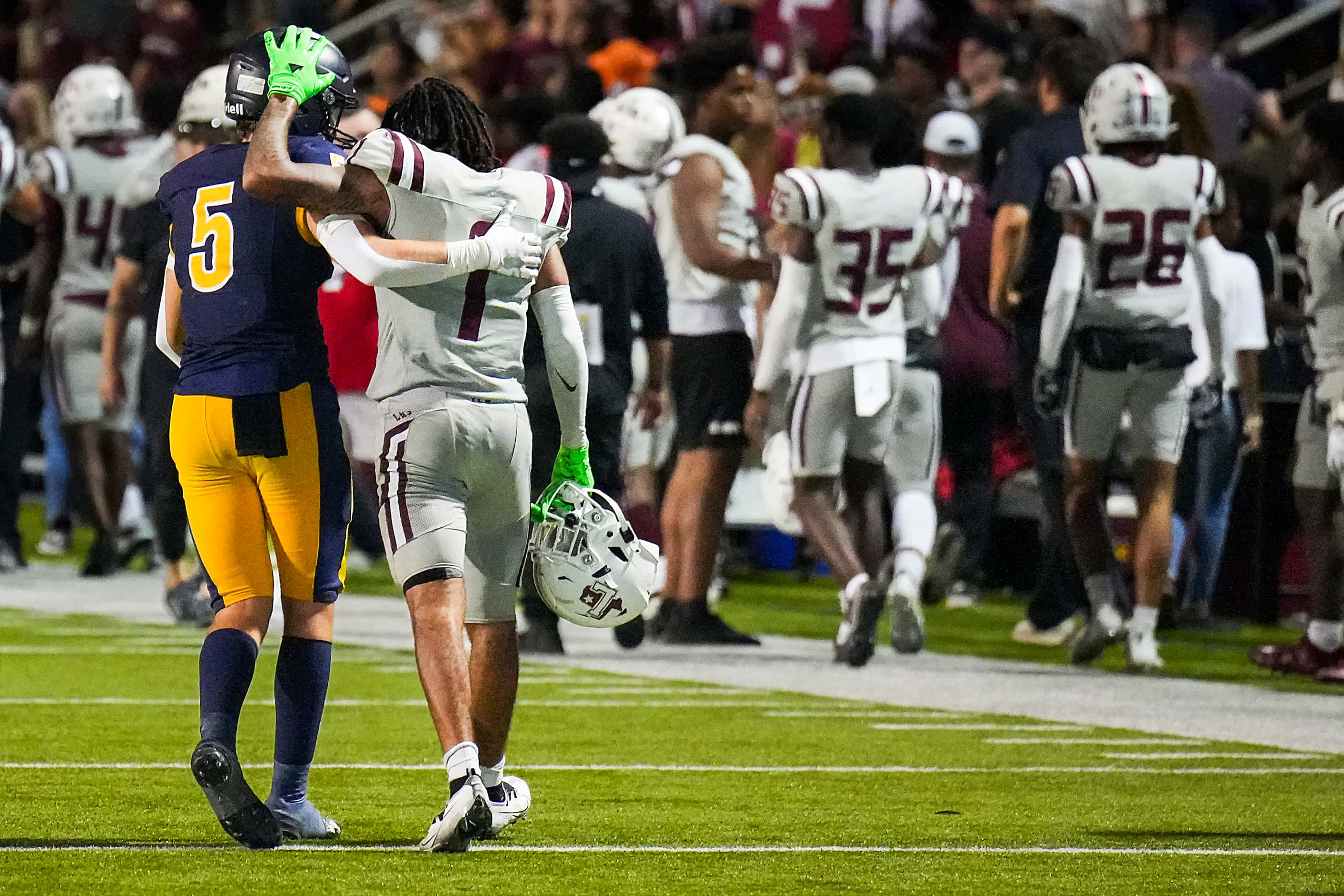 Lewisville’s Jaydan Hardy (1) is consoled by Highland Park’s Keller Holmes (5) after...