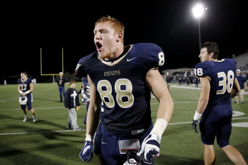 Keller defensive lineman Houston Miller (88) celebrates with teammates after earning a spot...