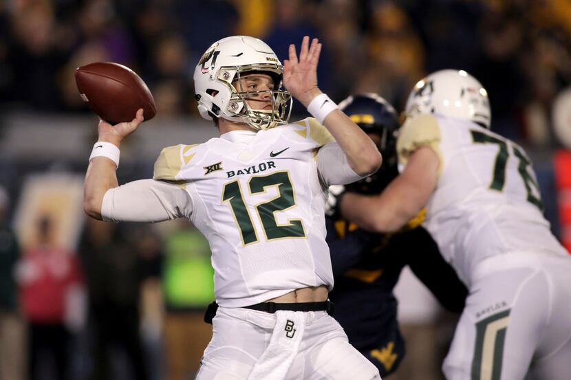 Baylor quarterback Charlie Brewer (12) looks to pass during the first half of an NCAA...