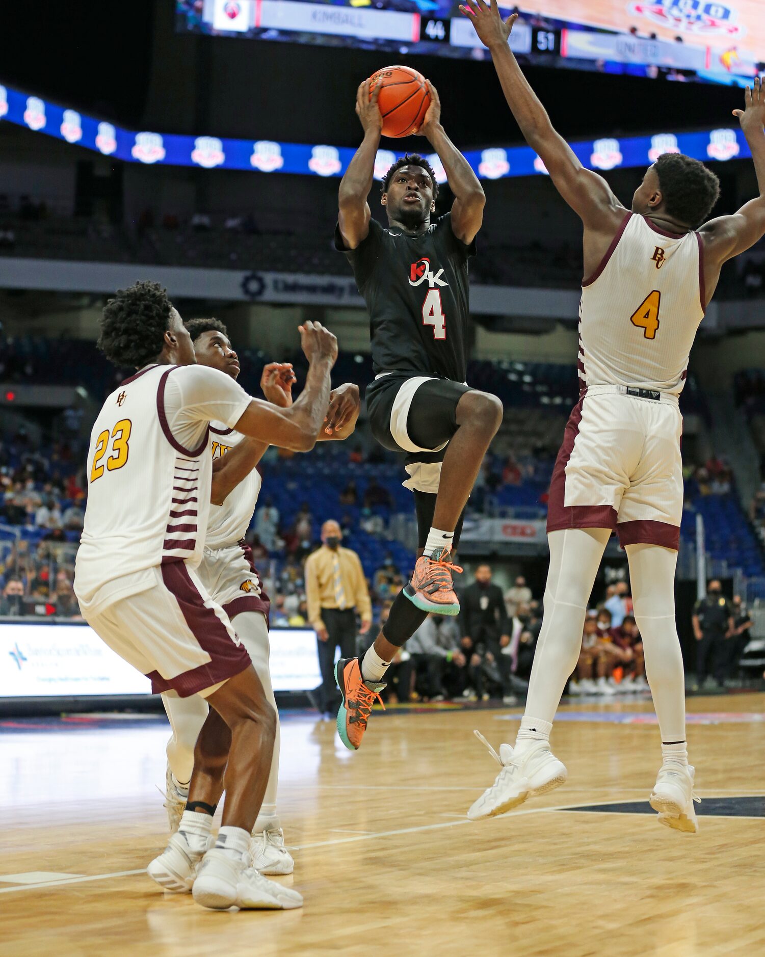 Dallas Kimball Kyron Henderson #4 shots over Beaumont United Trealyn Porchia #4. UIL boys...