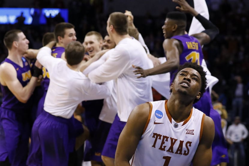 Texas guard Isaiah Taylor (1) reacts as the Northern Iowa team celebrates after guard Paul...