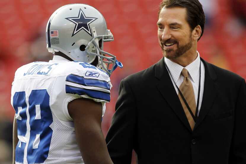 Dallas Cowboys running back Felix Jones (28) is greeted by sports reporter Babe Laufenberg...