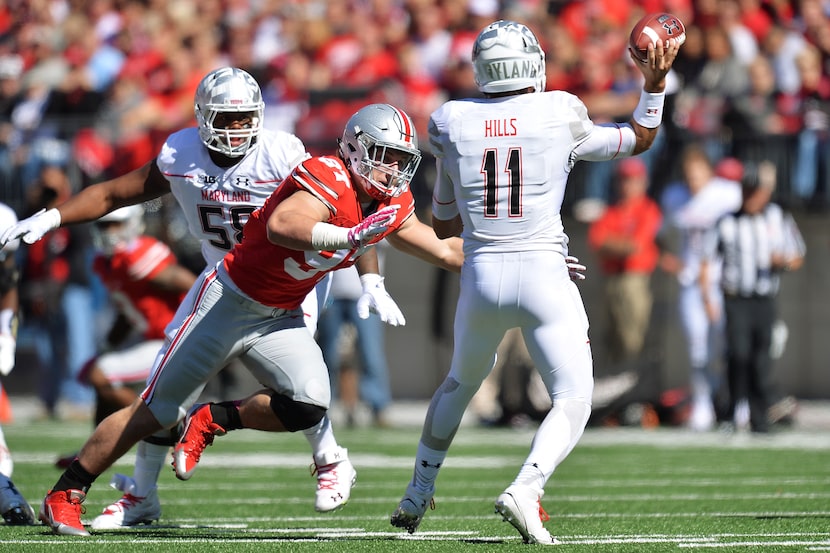 COLUMBUS, OH - OCTOBER 10:  Joey Bosa #97 of the Ohio State Buckeyes applies pressure to...