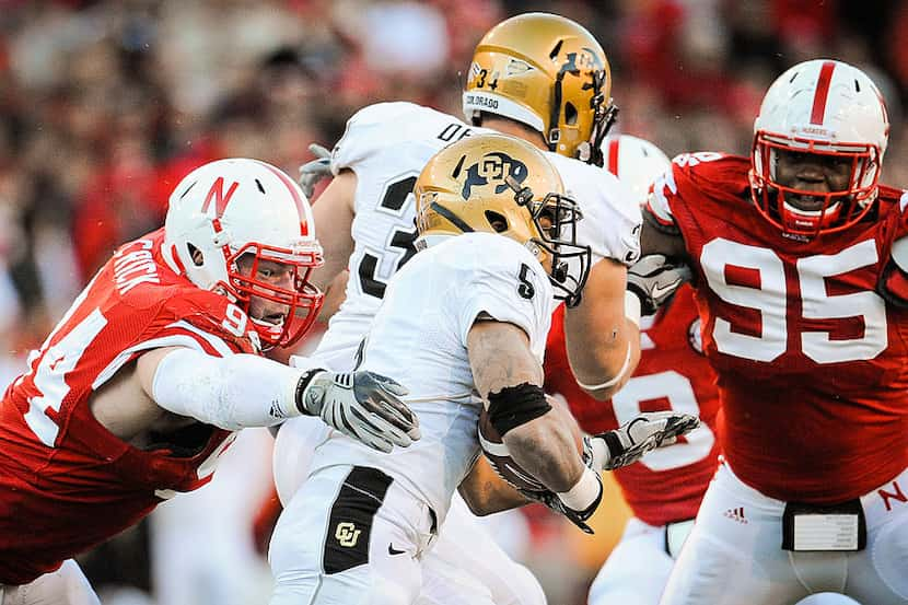 LINCOLN, NE - NOVEMBER 26: Jared Crick #94 and Pierre Allen #95 of the Nebraska Cornhuskers...