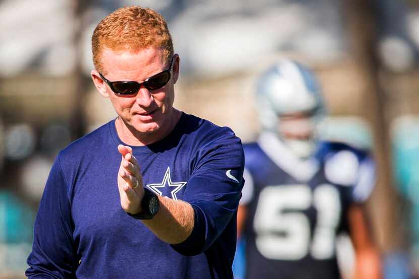 Dallas Cowboys head coach Jason Garrett directs a play during practice at training camp on...