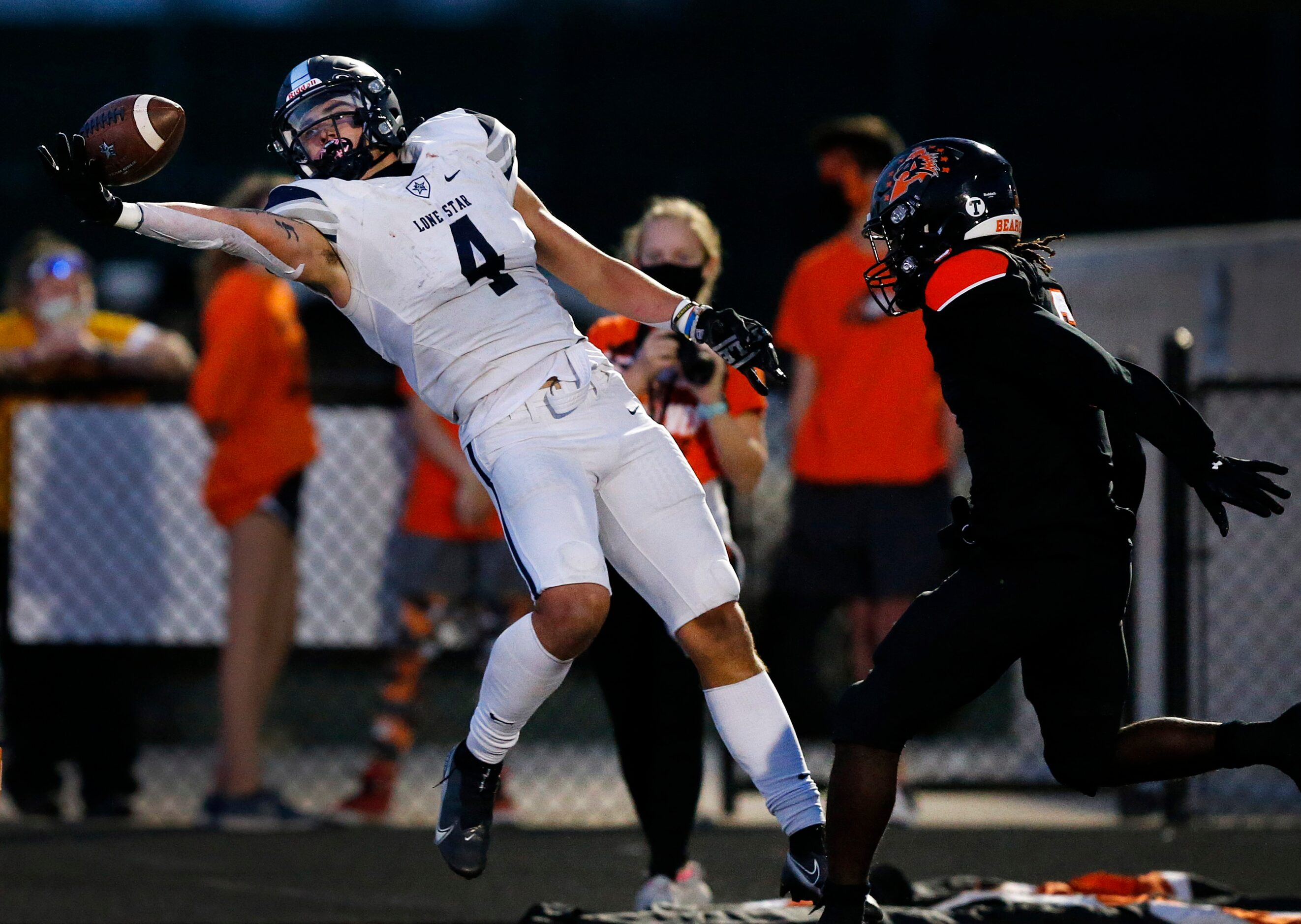 Frisco Lone Star wide receiver Trace Bruckler (4) attempts a one-handed grab on a two-point...