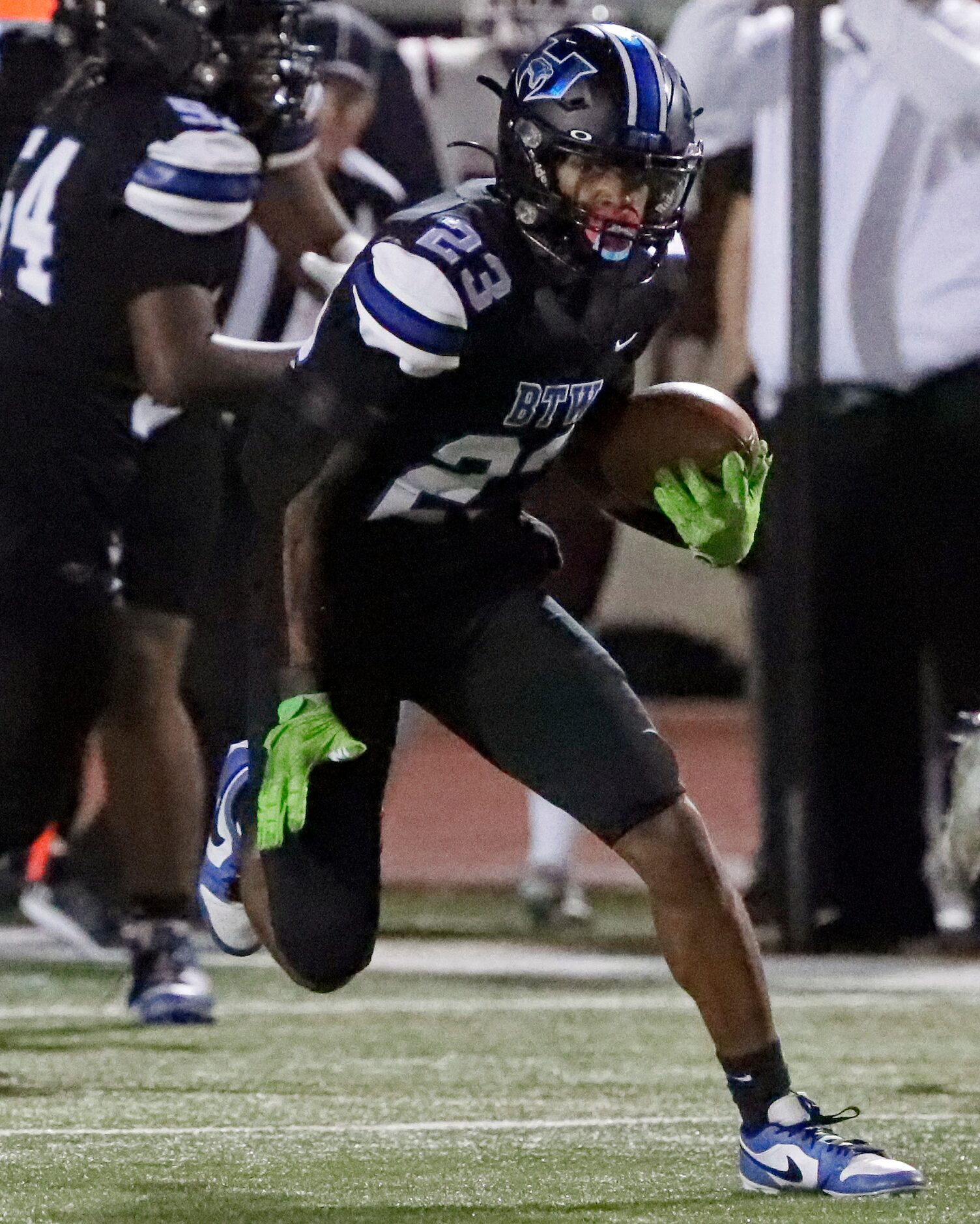 Hebron High School running back Nolan Ivery (23) runs for a first down during the first half...