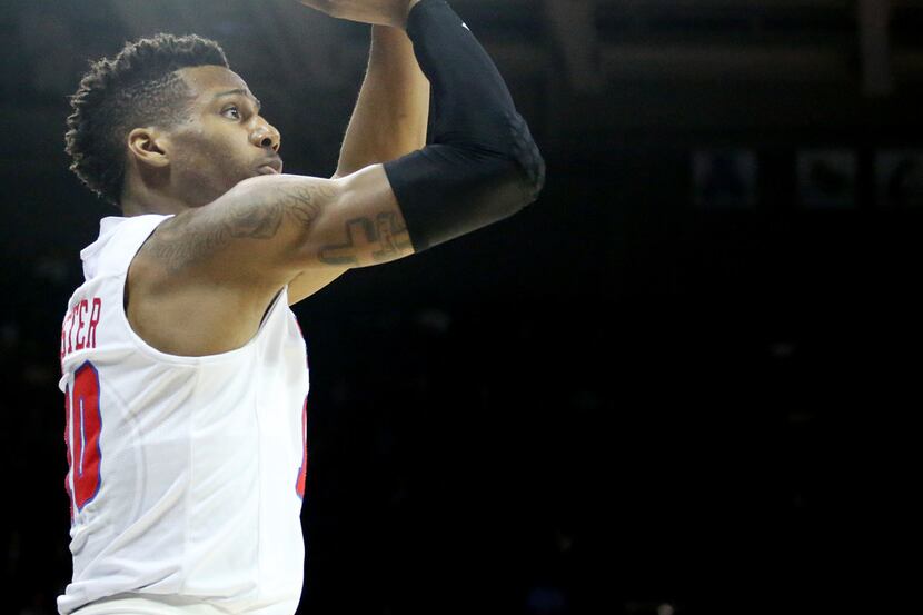 SMU guard Jarrey Foster (10) shoots the ball in the first half of an NCAA basketball game...