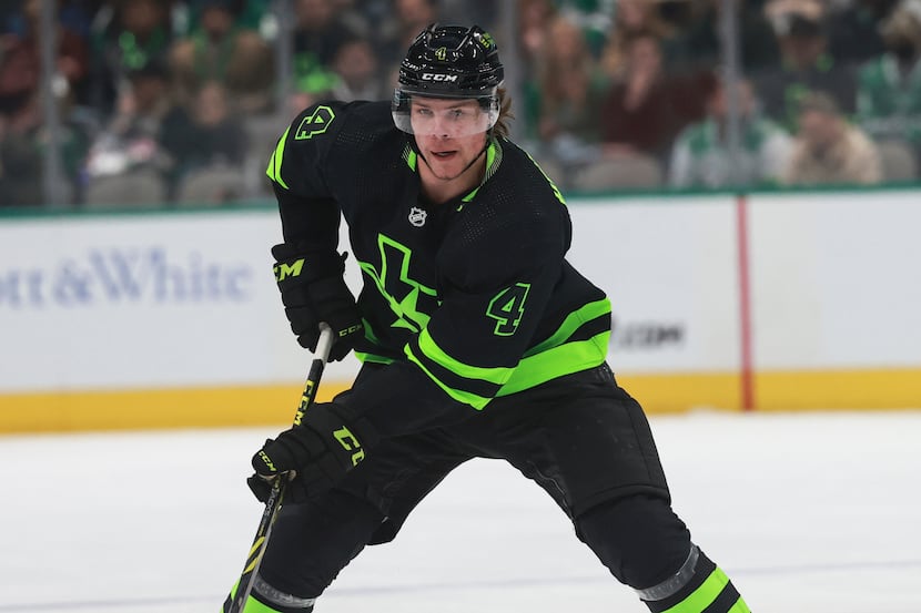 Dallas Stars defenseman Miro Heiskanen (4) skates the puck up the ice during an NHL game...