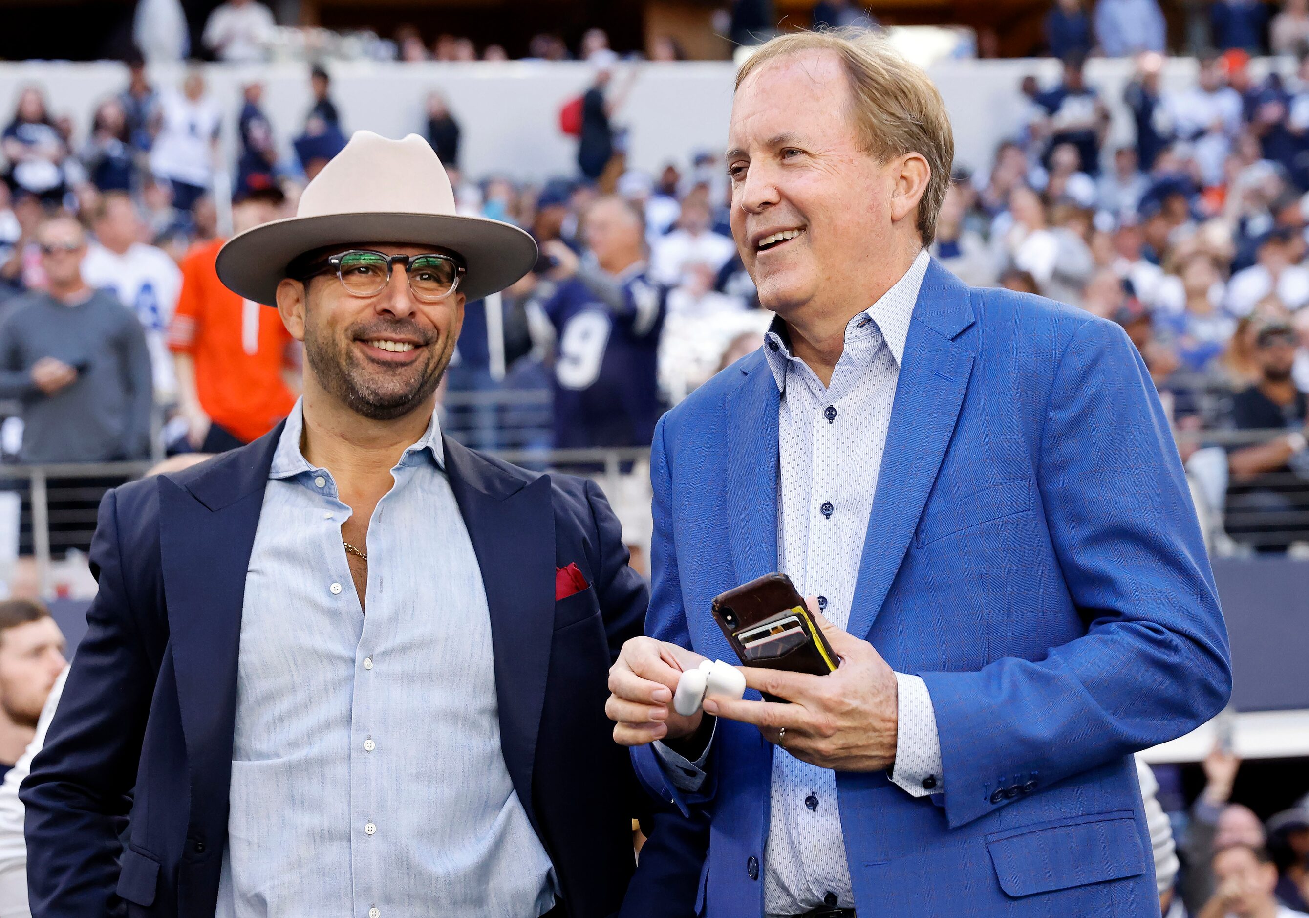 Texas Attorney General Ken Paxton (right) was one the sidelines with others VIPs before the...