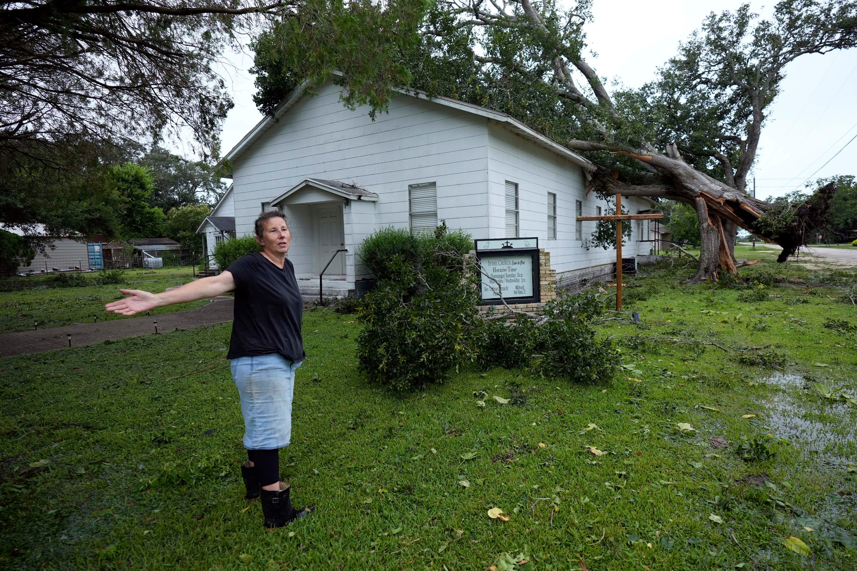 Ann McCauley examines the damage at Bethel Church after Hurricane Beryl moved through the...