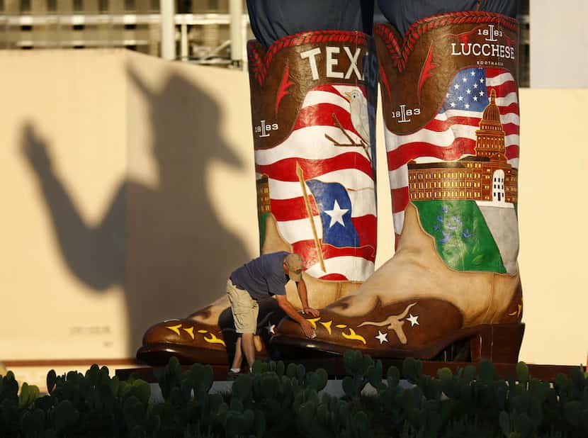 Big Tex's boots are 10 feet, 6 inches long and weight about 900 pounds each.