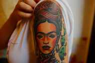Dione Lugones shows off her tattoo of Mexican artist Frida Kahlo in Havana, Cuba, in 2016....