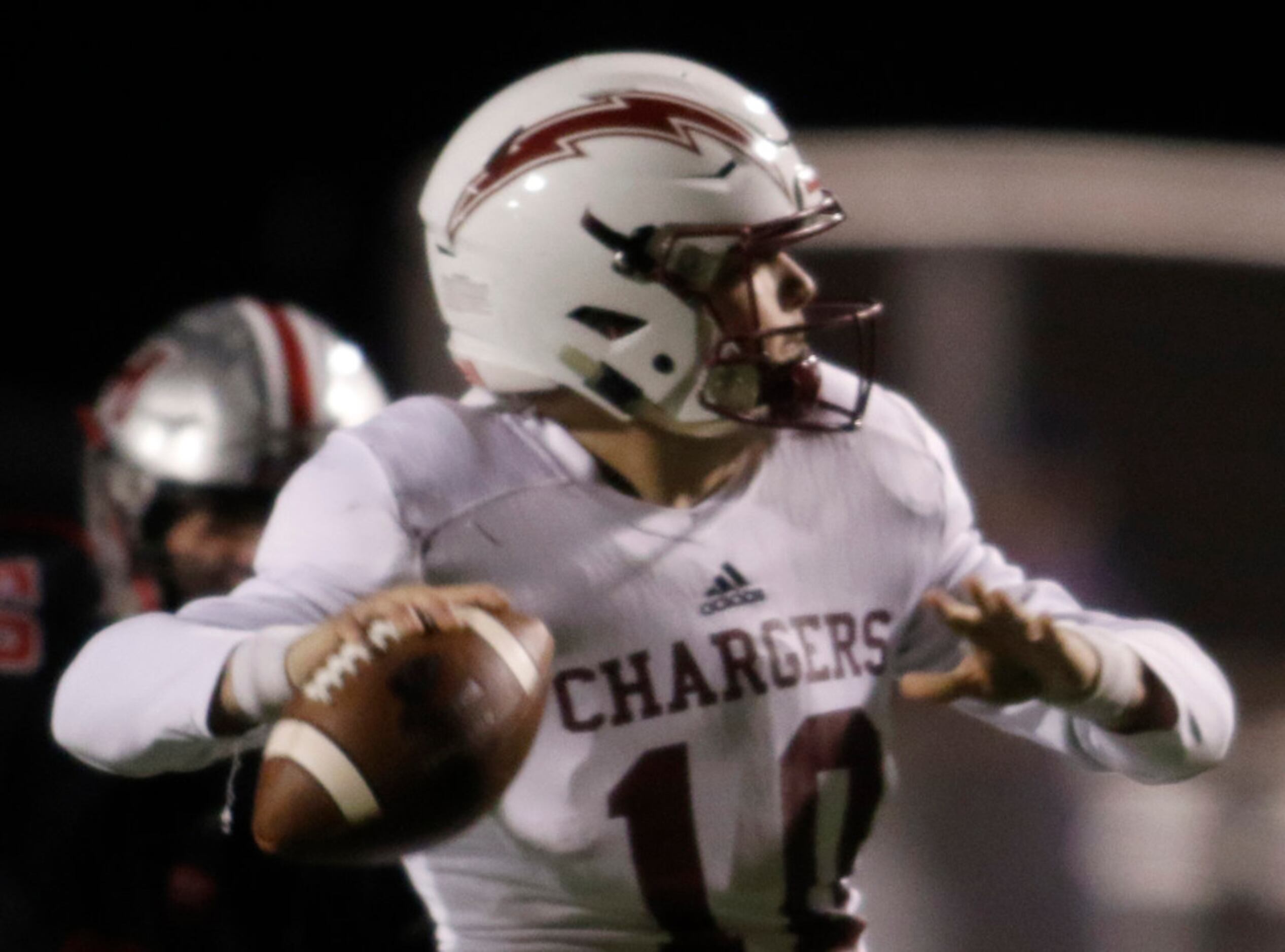 Keller Central quarterback Gavyn White (10) looks to pass during first quarter action...