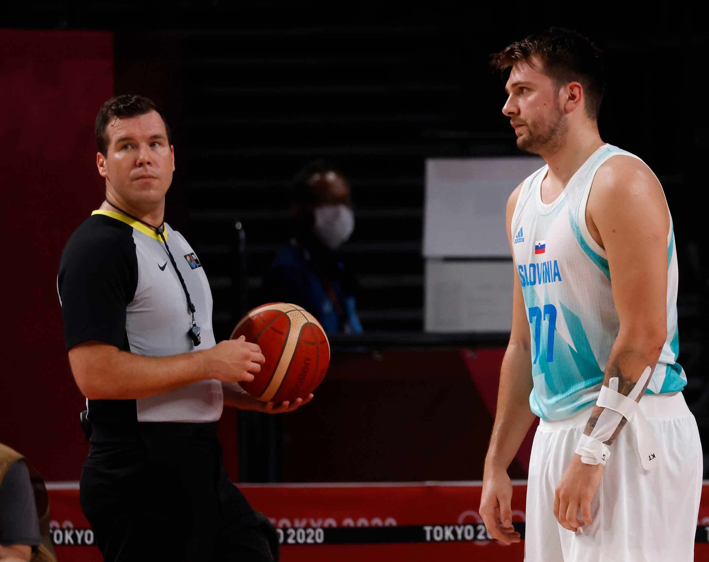 Slovenia’s Luka Doncic (77) stares in the direction of the official after a play in a game...