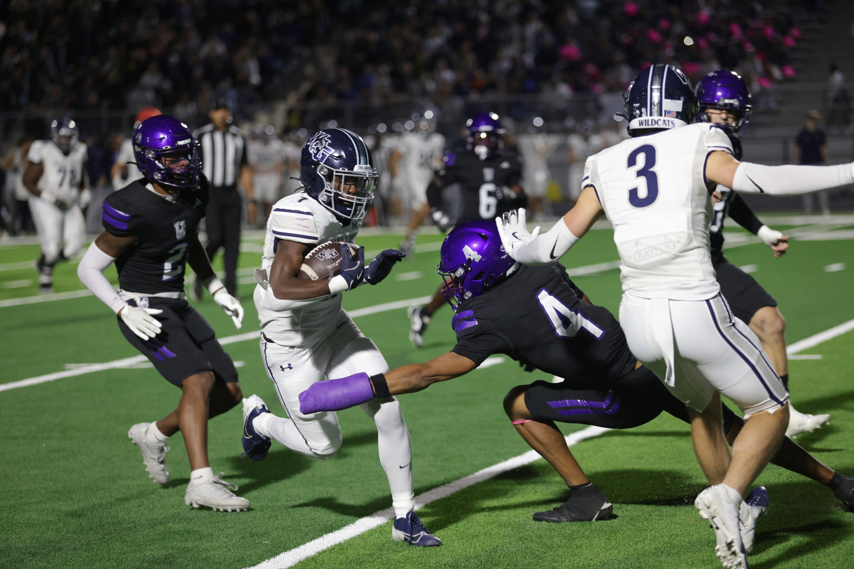 Walnut Grove player #1 Cam Newton gets stopped by Anna player #4 Ashton Ansley during the...