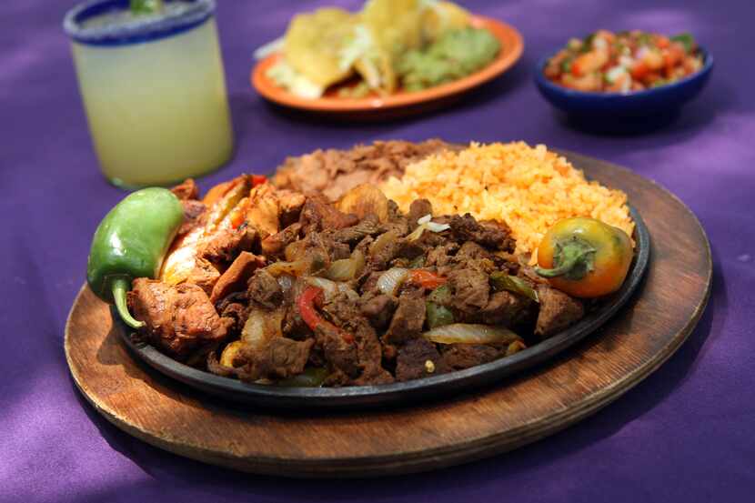 A margarita and a plate of Tex-Mex on the patio at Joe T. Garcia's in Fort Worth: That's a...