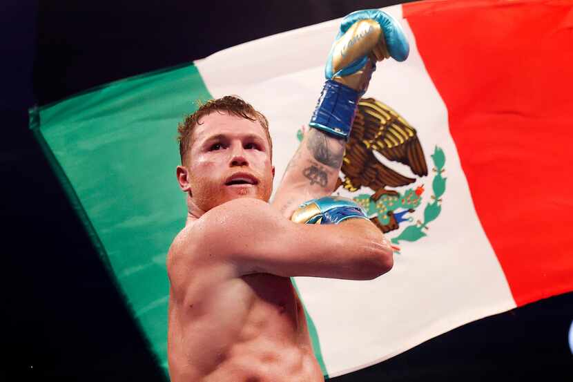 Boxers Canelo Alvarez celebrates after defeating Billy Joe Saunders in the eighth round of...