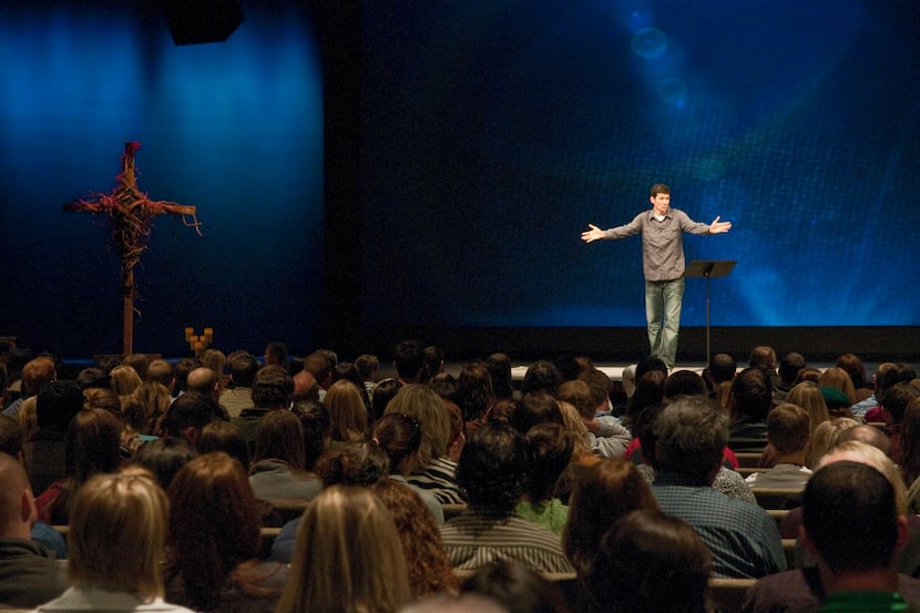 Matthew Chandler, pastor of The Village Church in Flower Mound, gives a sermon in 2010. On...