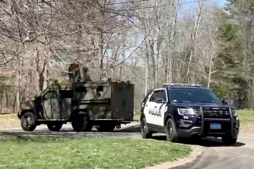 In this image taken from video, police block a road in North Dighton, Mass., Thursday, April...
