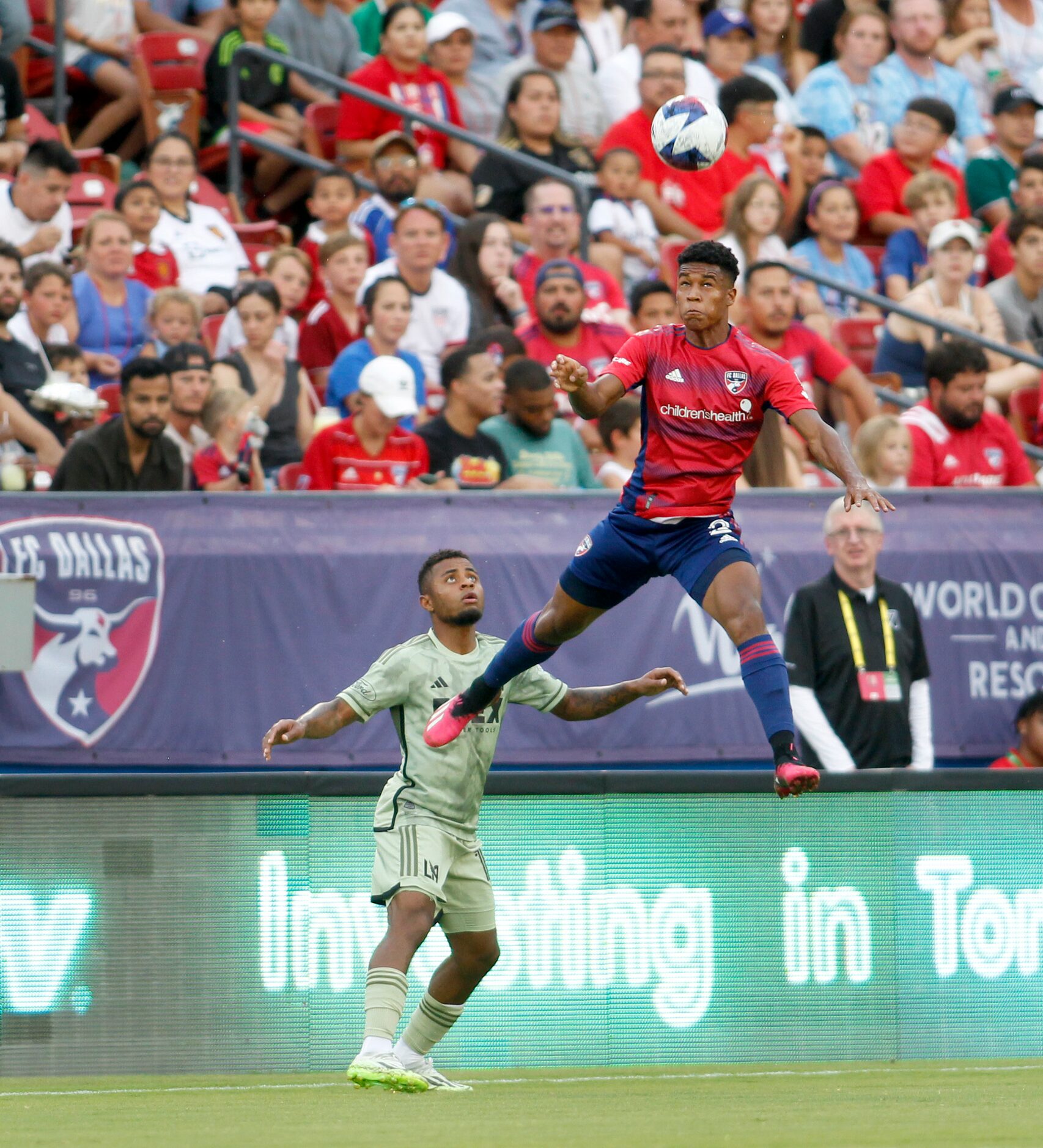 FC Dallas defender Geovane de Jesus Rocha (2) skies to intercept a pass intended for LA FC...