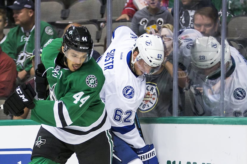 Dallas Stars right wing Matej Stransky (44) gets tied up along the boards with Tampa Bay...