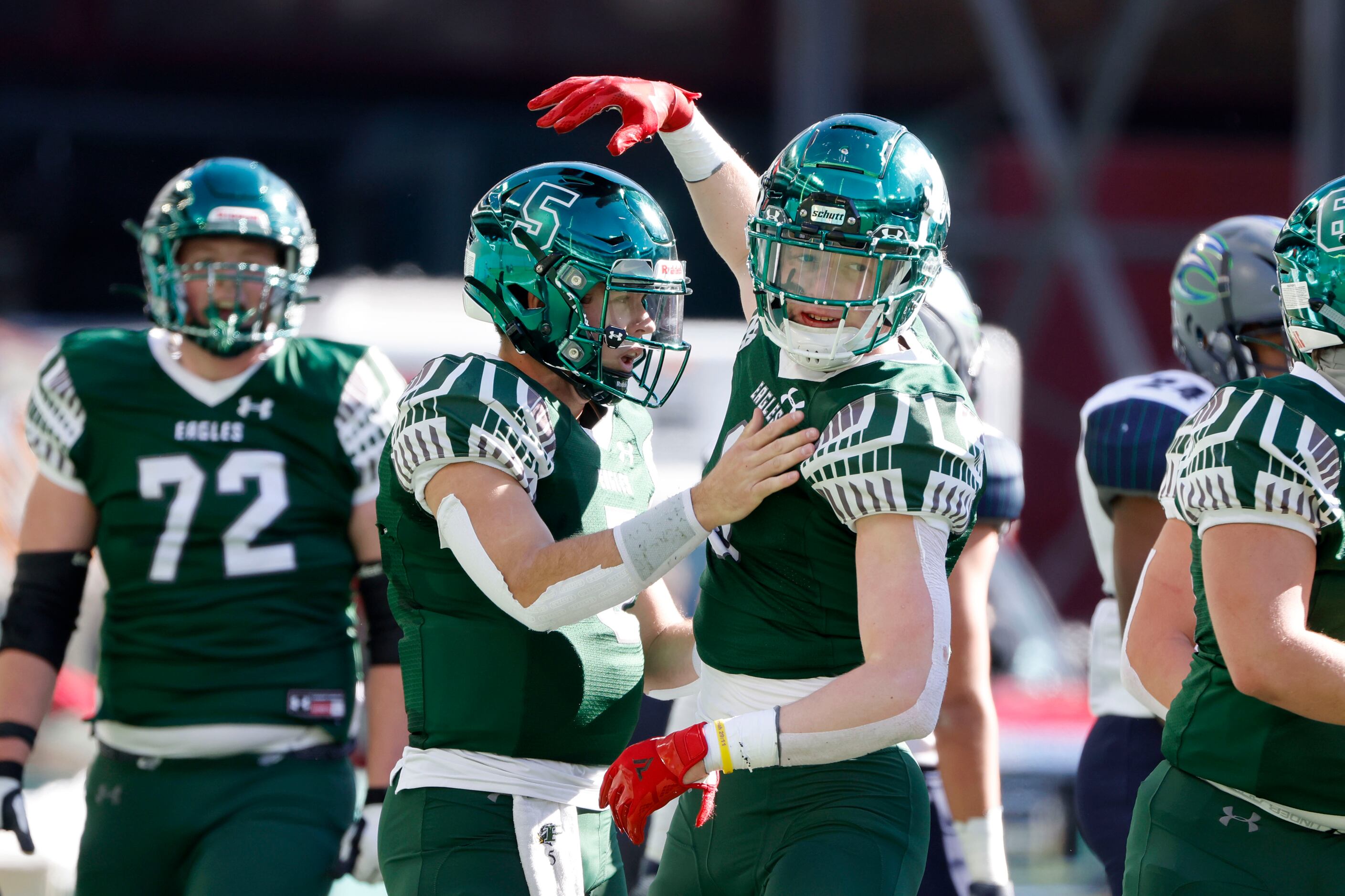 Prosper quarterback Jackson Berry (5), left, celebrates his rushing touchdown against...