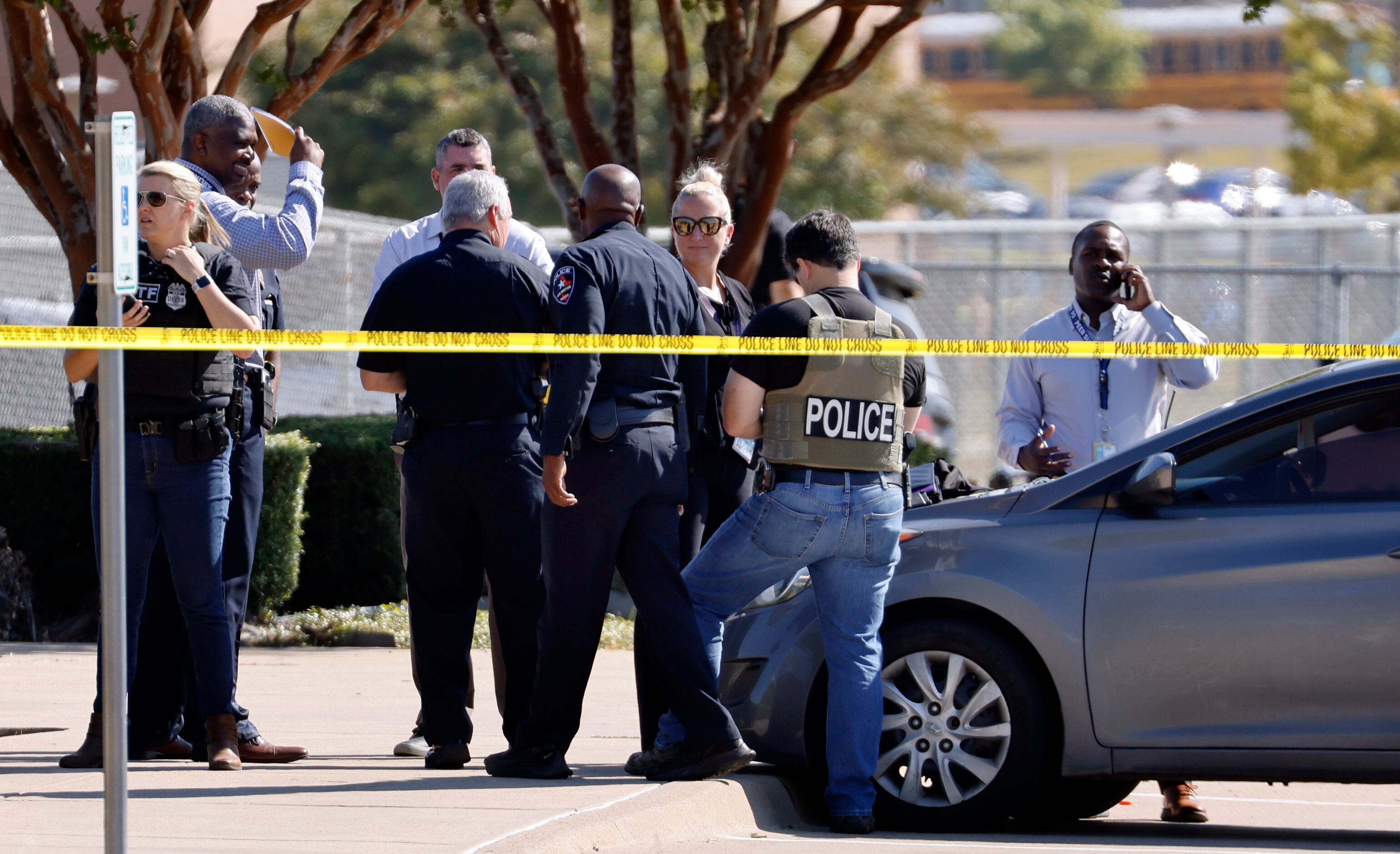 Police officials work the scene of a school shooting at Mansfield Timberview High School in...