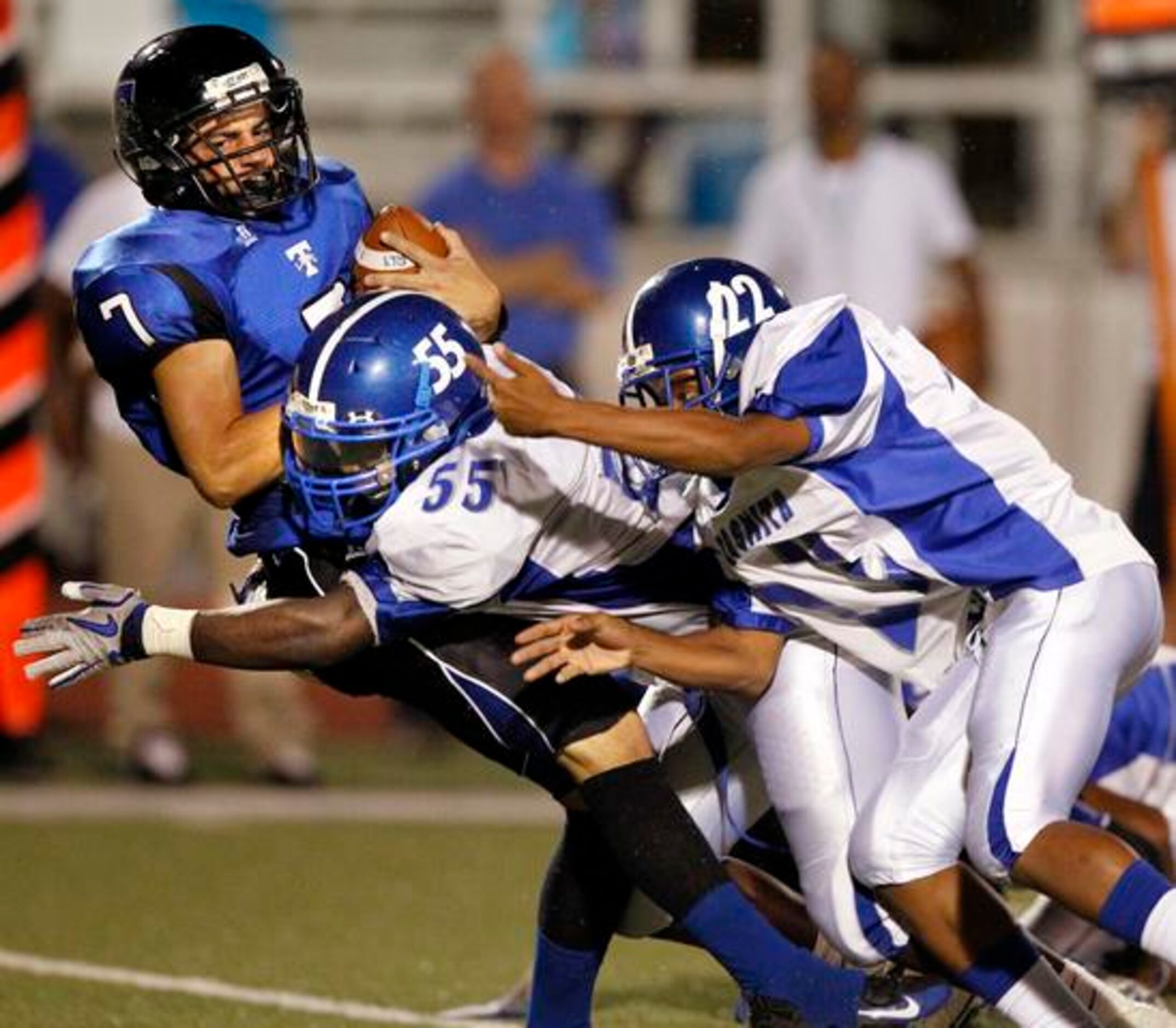 R.L. Turner QB Garon Goodspeed (7) is sacked by A. Maceo Smith defenders, including Antonio...