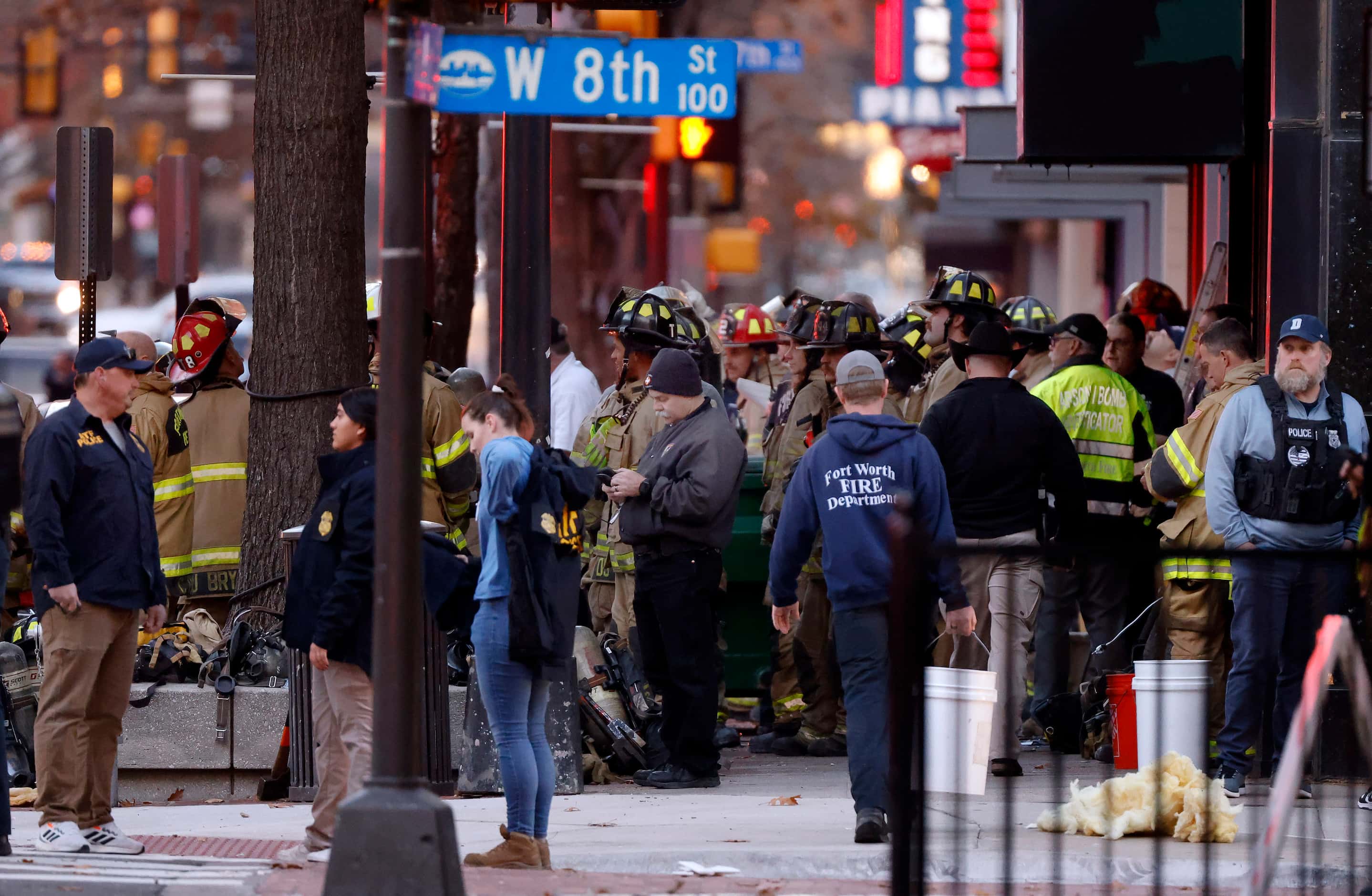 Officials gathered on Houston St. following an explosion that occurred at the Sandman...
