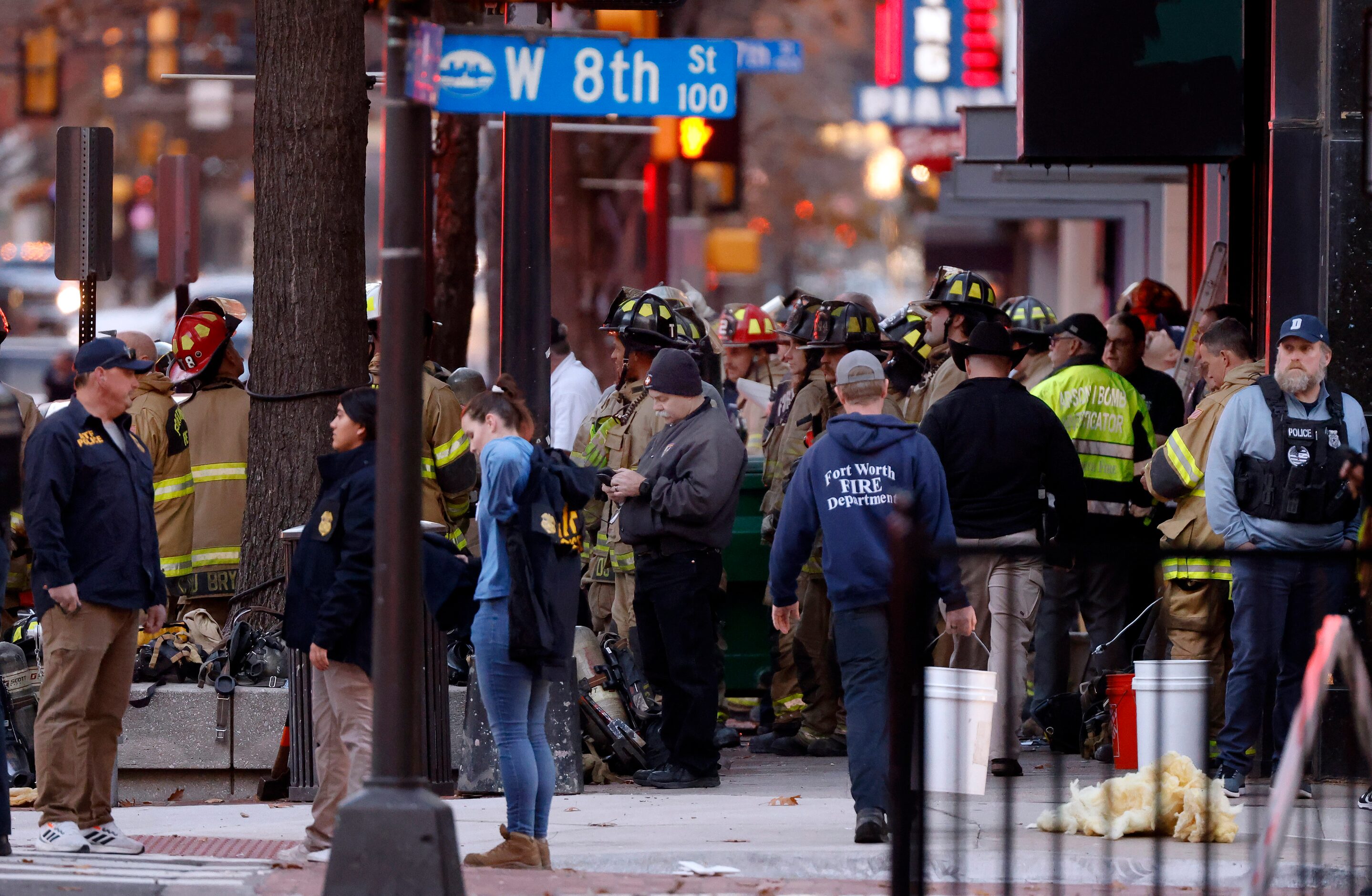 Officials gathered on Houston St. following an explosion that occurred at the Sandman...