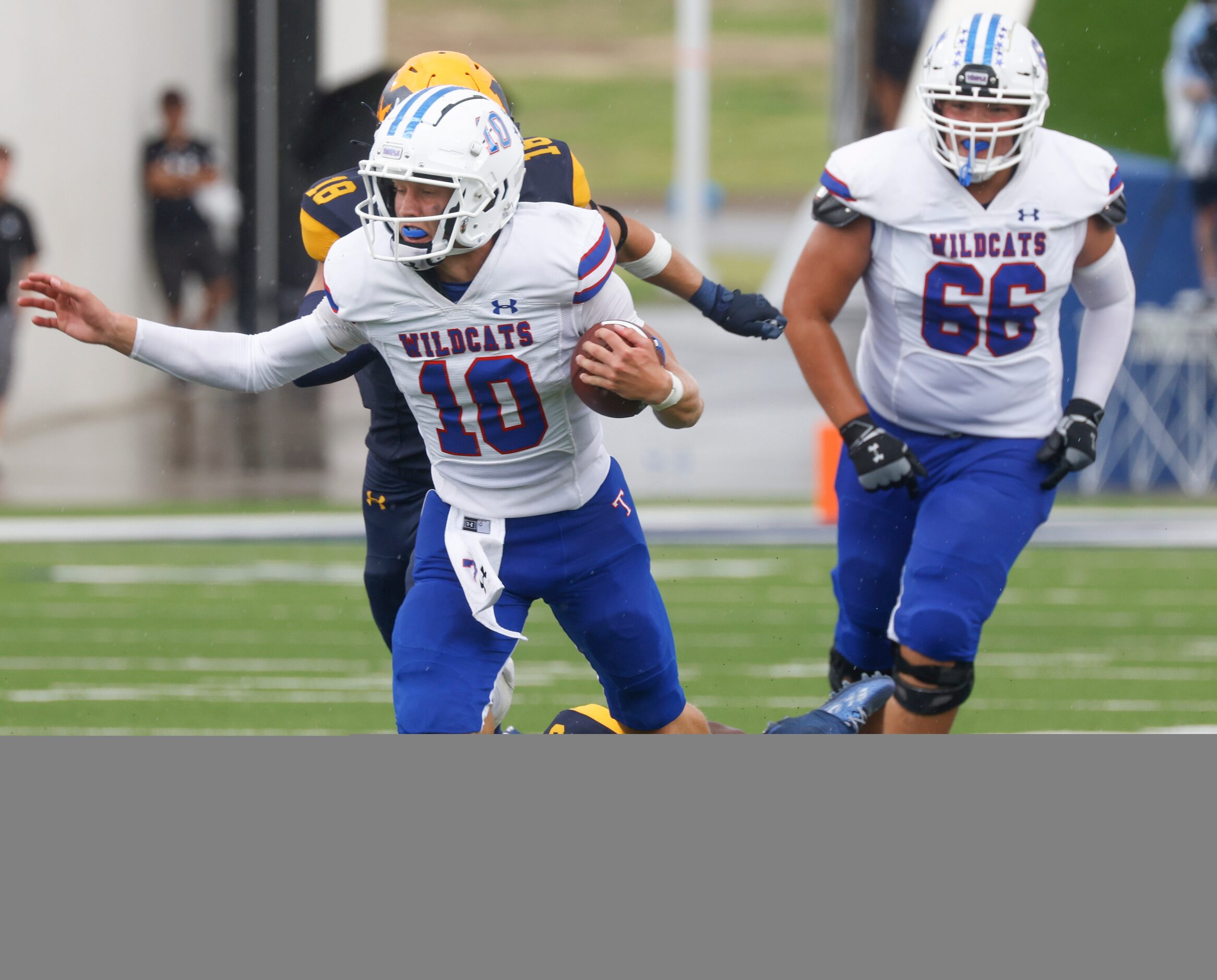 Temple High’s QB Reese Rumfield (10) gets tackled by  McKinney High’s Myles Elam (3) as he...