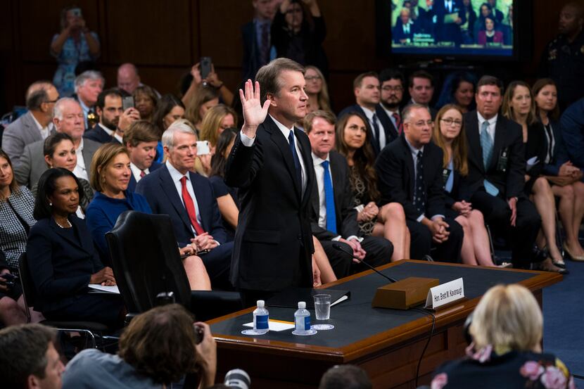 Judge Brett Kavanaugh, President Donald Trump's Supreme Court nominee, is sworn in at his...