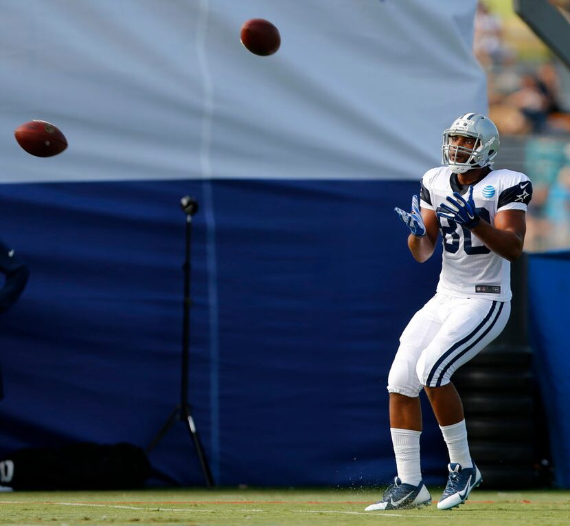 Dallas Cowboys rookie tight end Rico Gathers (80) has tow balls thrown his way at the same...