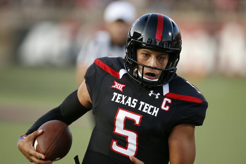 Texas Tech's Pat Mahomes runs the ball into the end zone to score his first touchdown...
