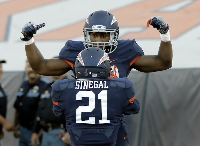 UTEP running back Aaron Jones celebrates his touchdown against Southern Miss with teammate...