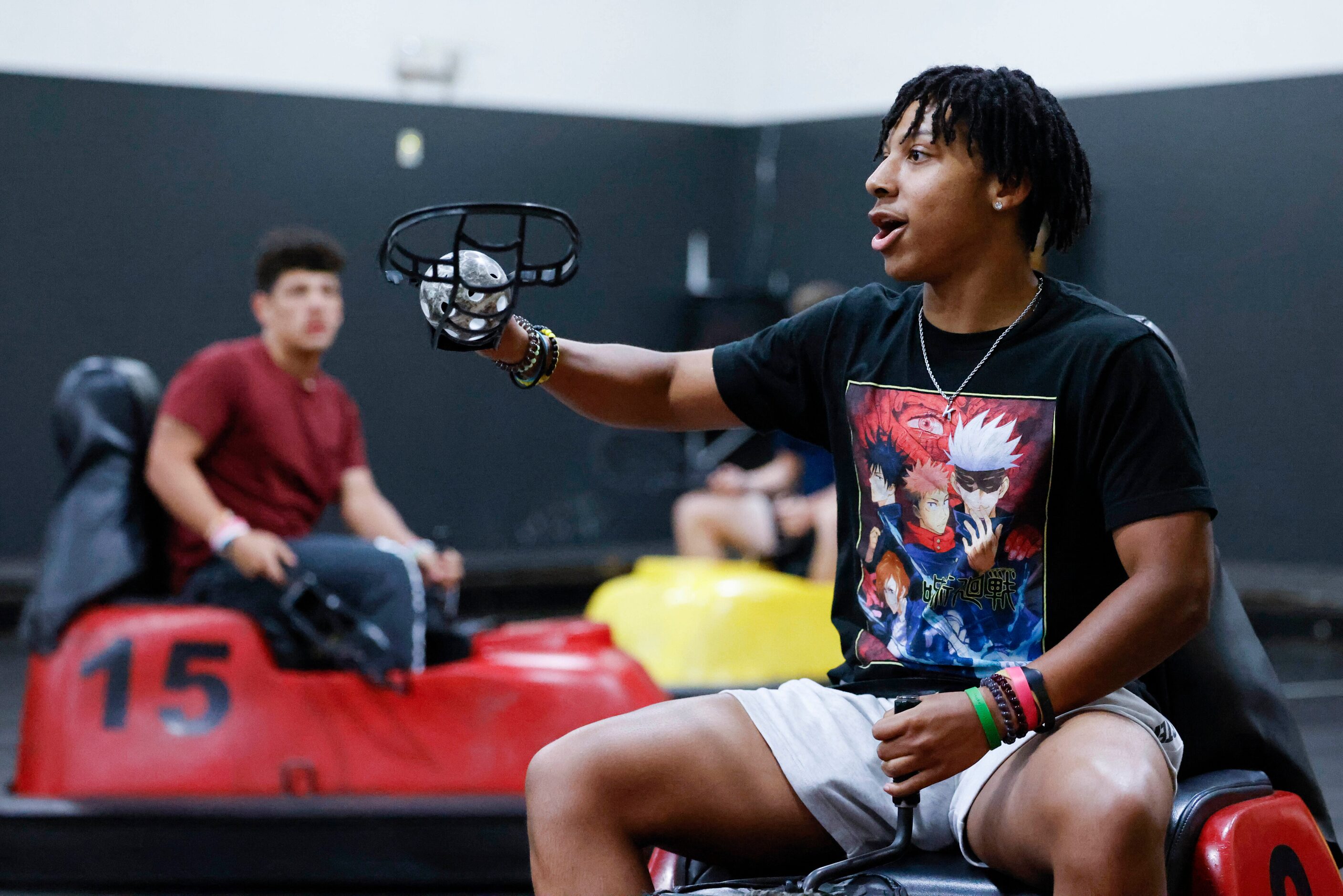 L.D. Bell High School football player Kenny Earskin moves with the ball during a whirlyball...