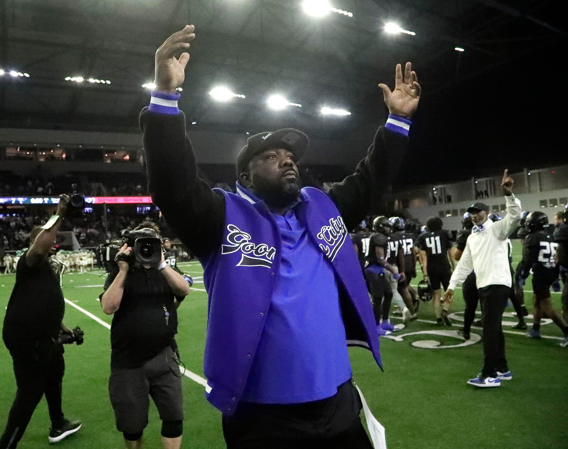 North Crowley High School head coach Ray Gates gestures to the fans after North Crowley High...