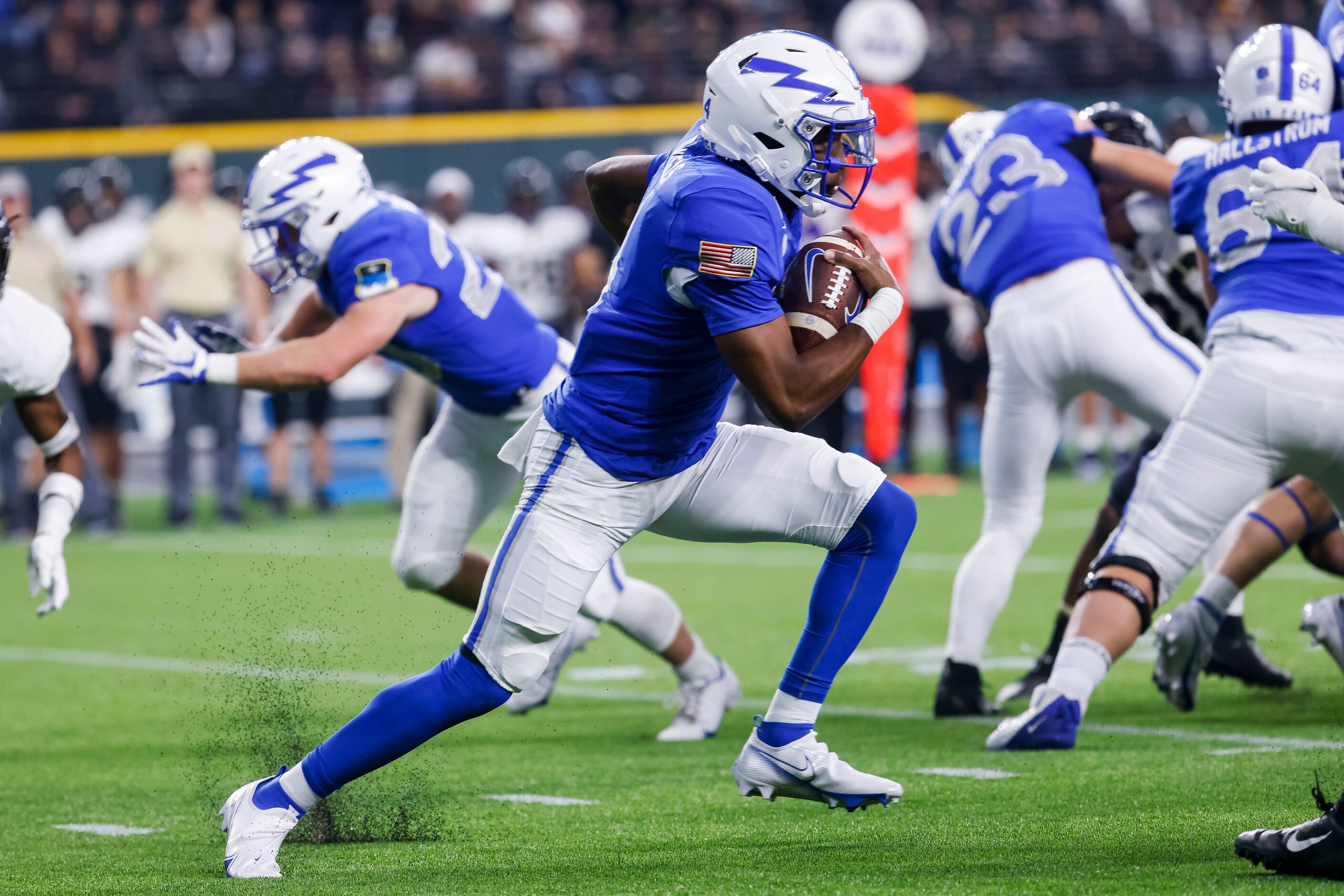 Air Force Falcons quarterback Haaziq Daniels (4) runs the ball during the second quarter of...