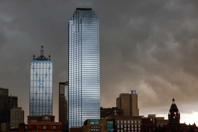 Storm clouds darken the sky as they move over downtown Dallas.