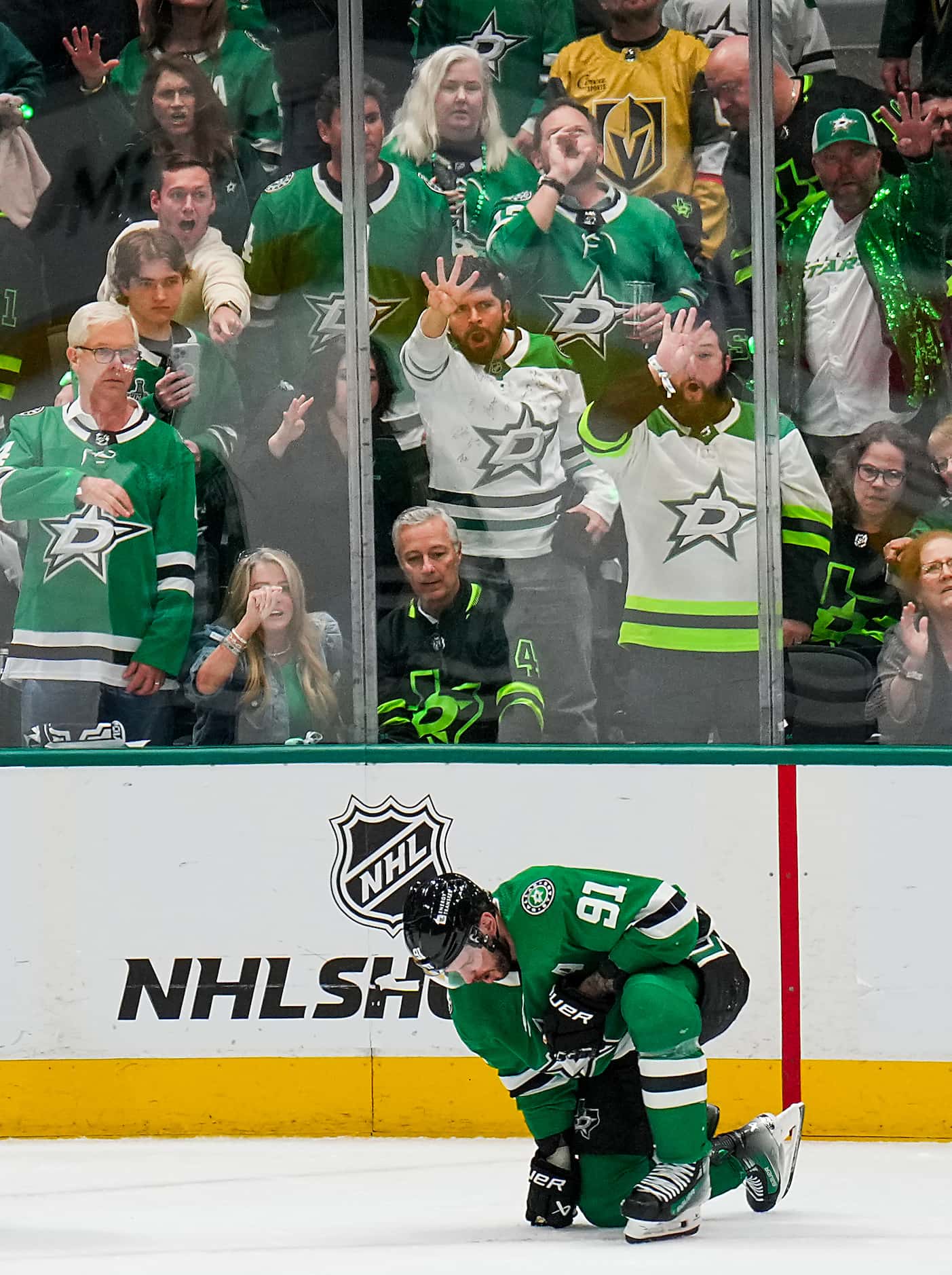 Dallas Stars center Tyler Seguin (91) is slow to get up after he was injured on a roughing...