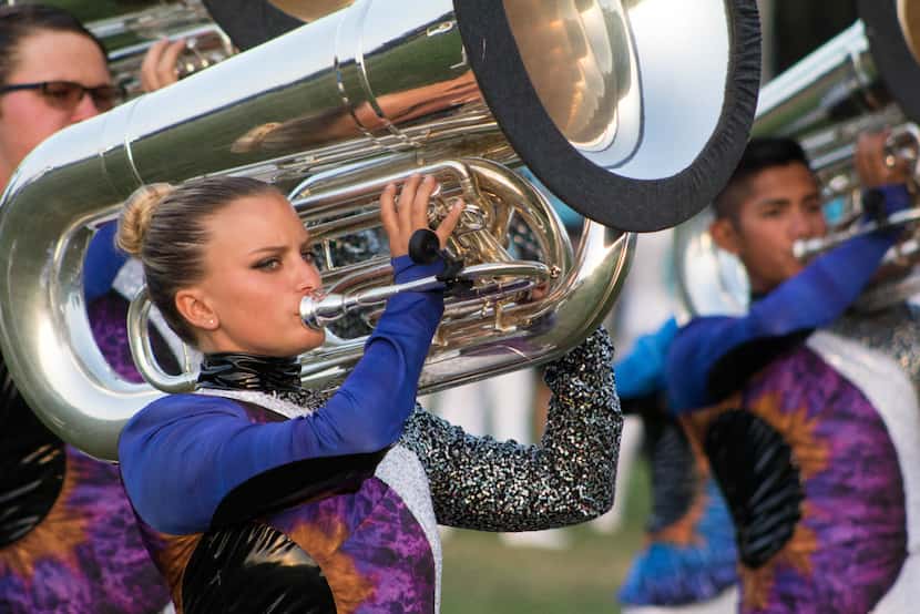 A Blue Knights tuba player performs with her section during their 2017 show.