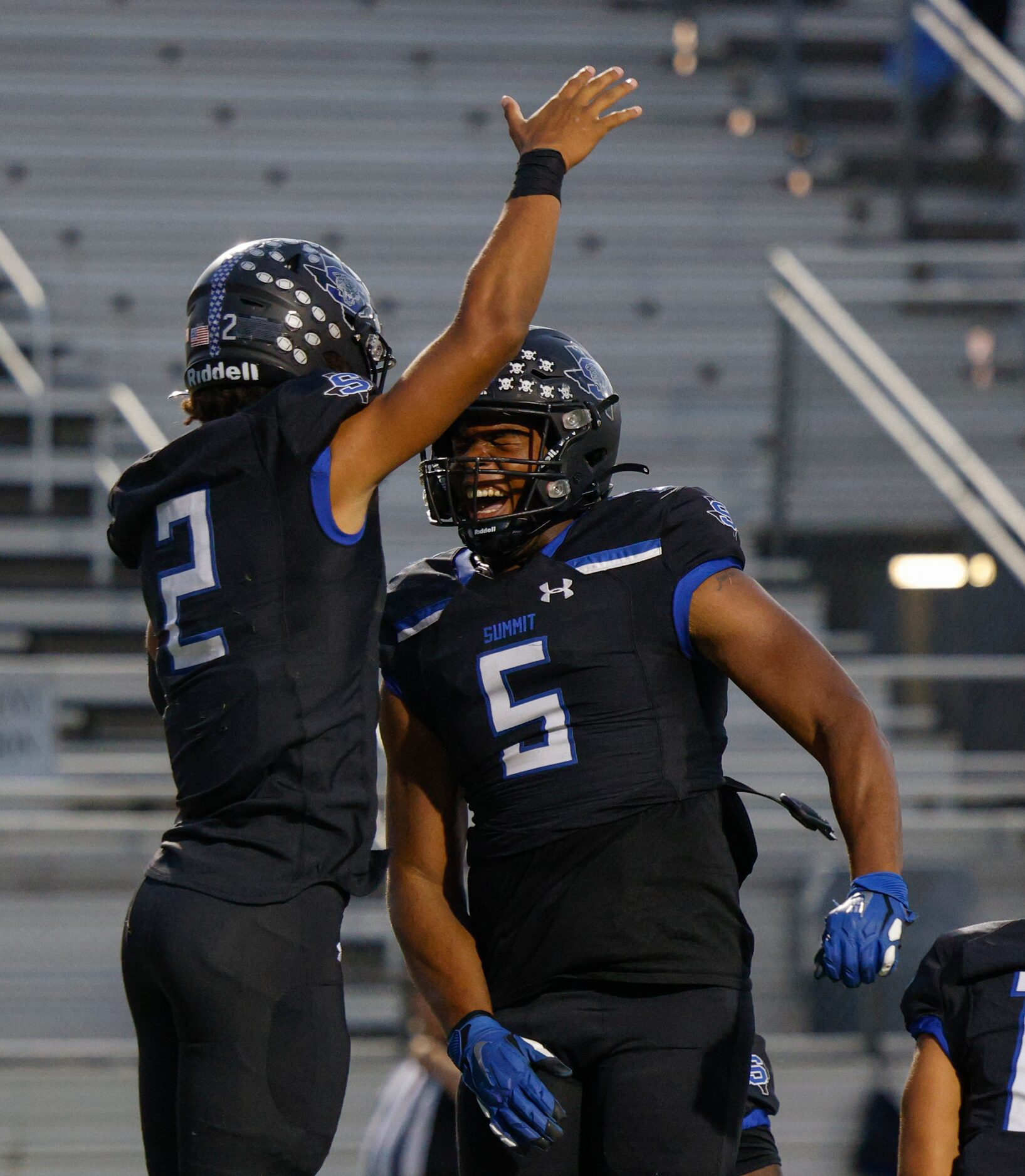 Mansfield Summit quarterback Joseph Williams (2) celebrates a touchdown with teammate Legend...