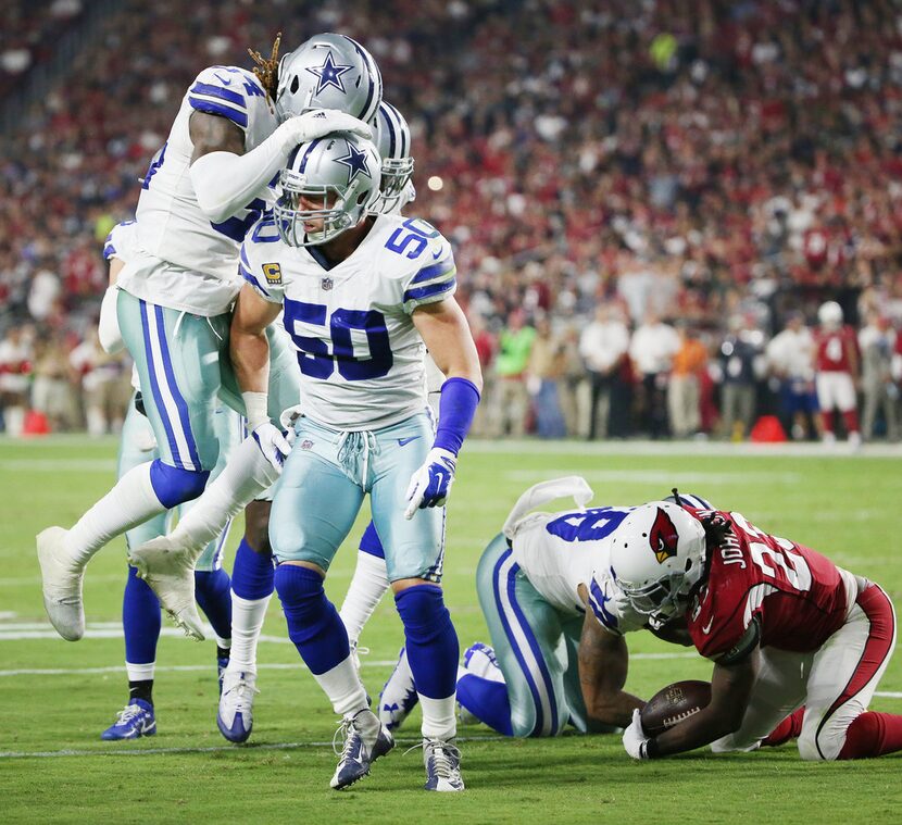 Dallas Cowboys middle linebacker Sean Lee (50) celebrates after tackling Arizona Cardinals...