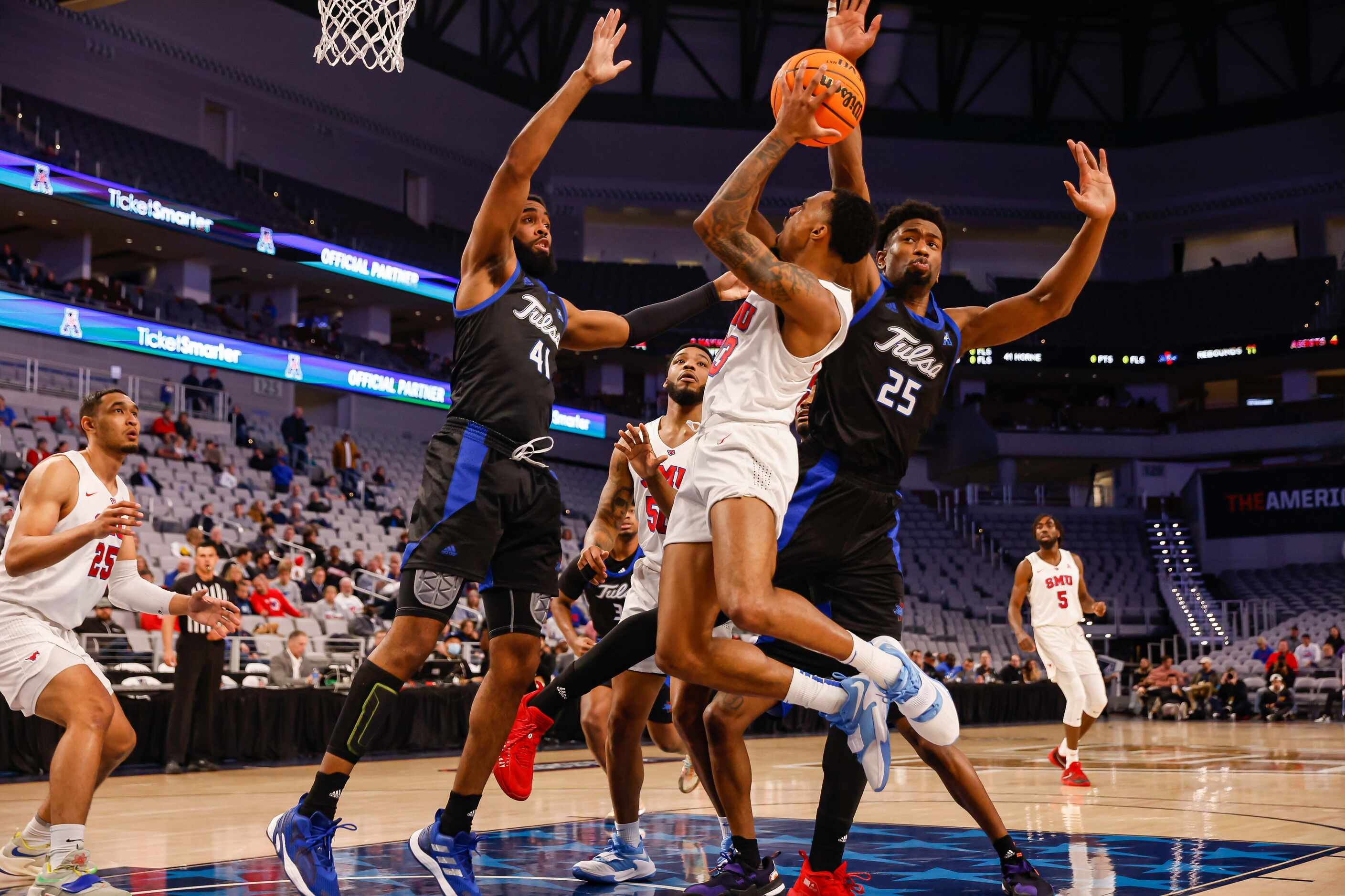 Southern Methodist Mustangs guard Michael Weathers (23) goes for a shot as Tulsa Golden...