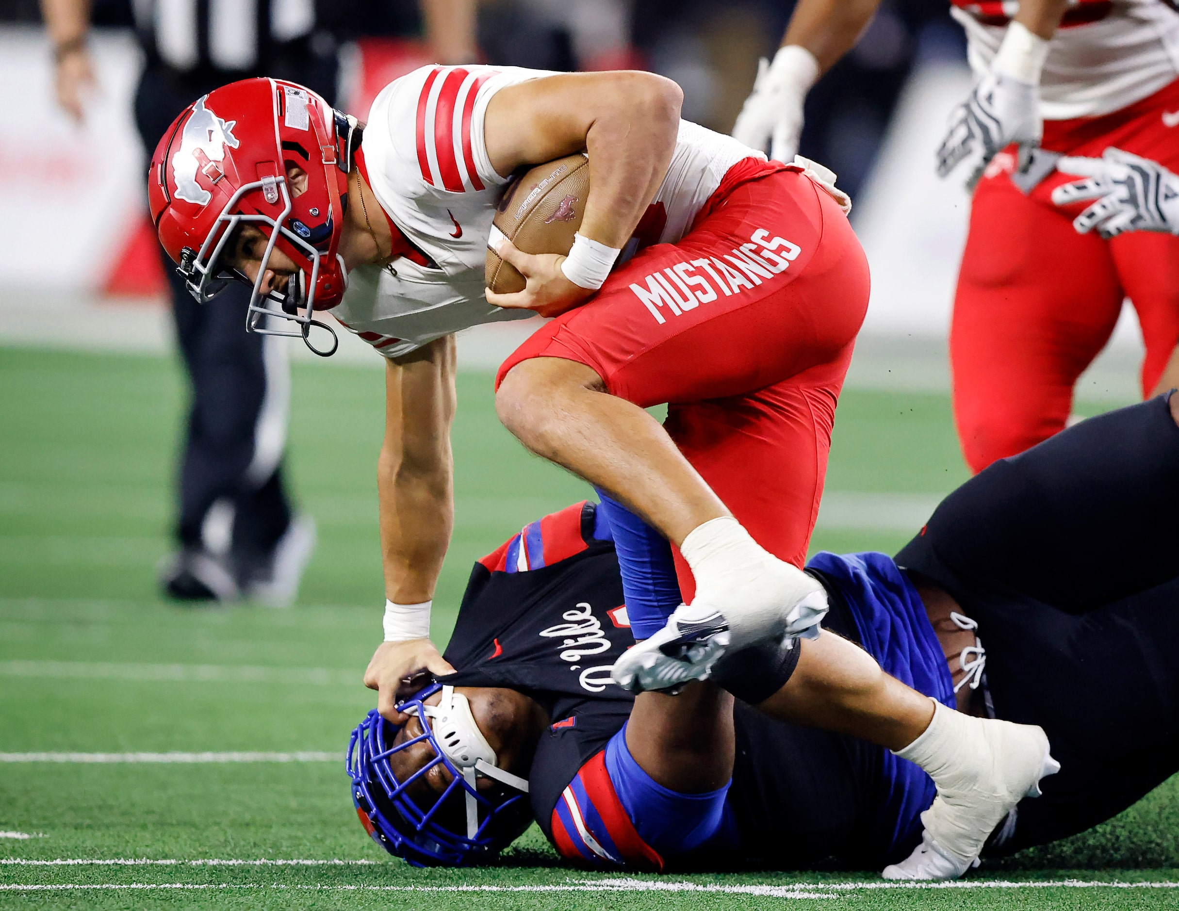 Duncanville defensive lineman Alex January (11) brings down Galena Park North Shore...