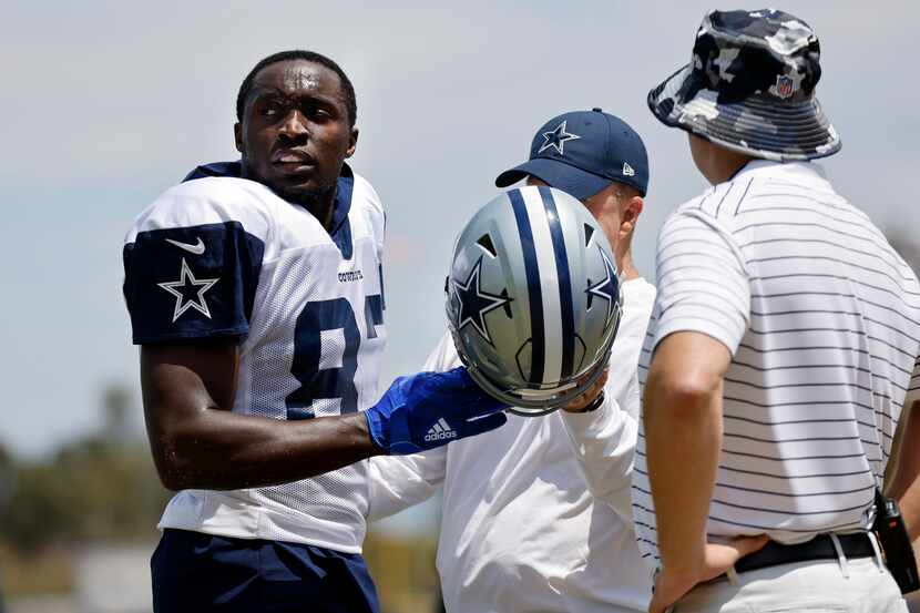 Dallas Cowboys wide receiver James Washington (83) looks for the cart following an injury...