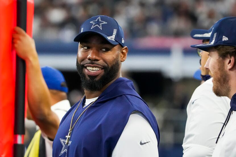 Dallas Cowboys offensive tackle Tyron Smith watches the game from the sidelines during the...